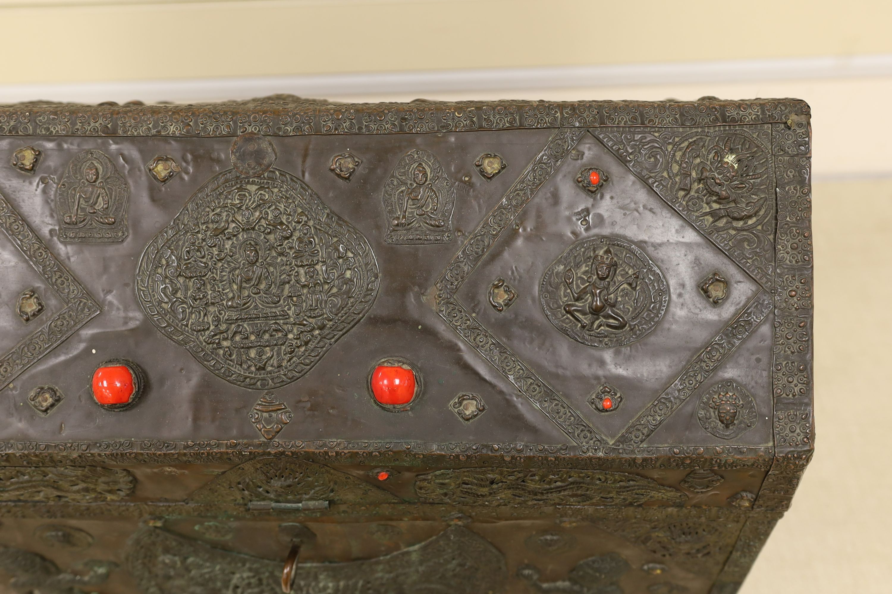 A Tibetan copper repousse-work casket, 20th century, 65cm wide, 49.5cm